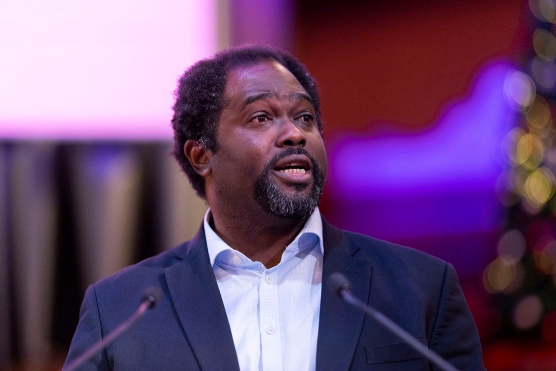 Ayo Akande speaking at a conference