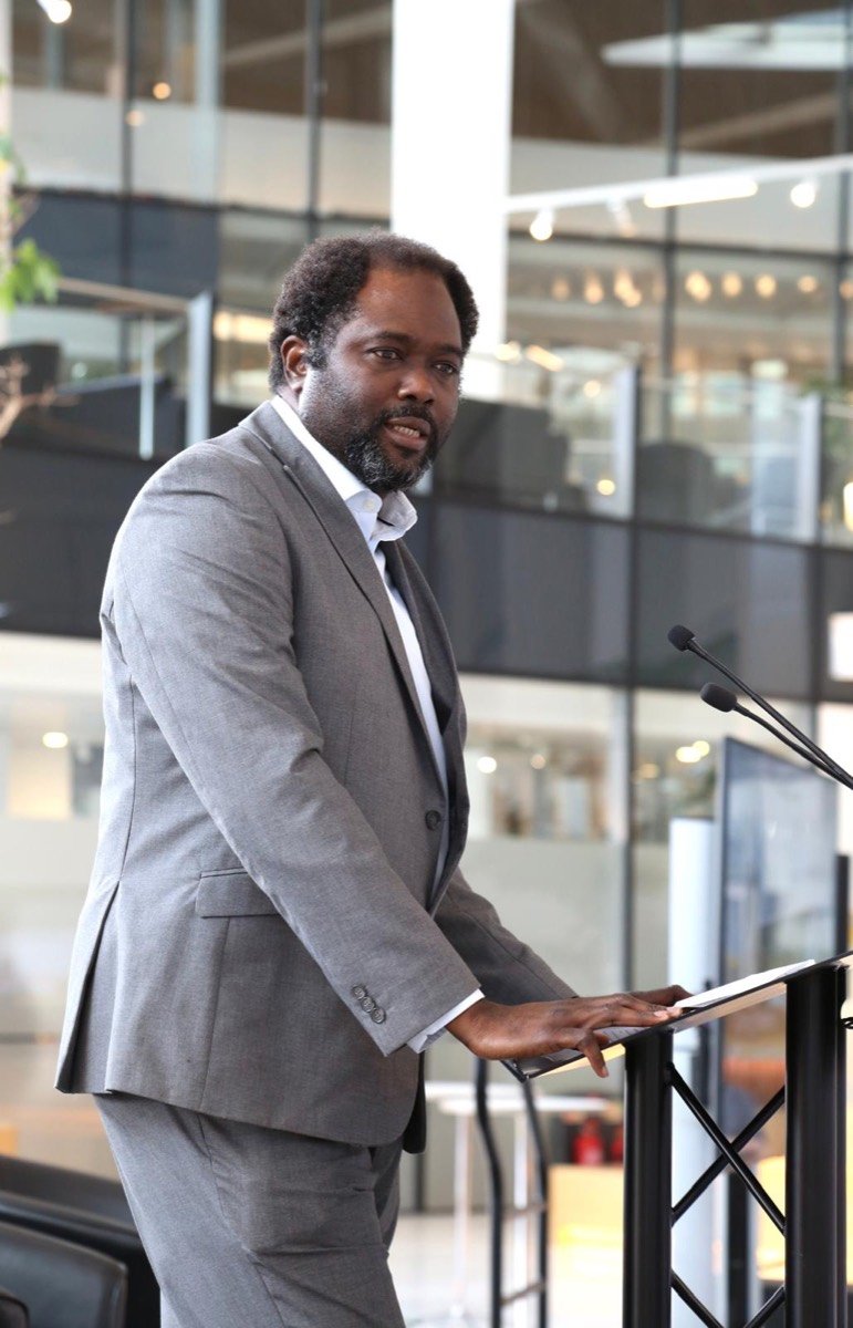 Ayo Akande at a lectern